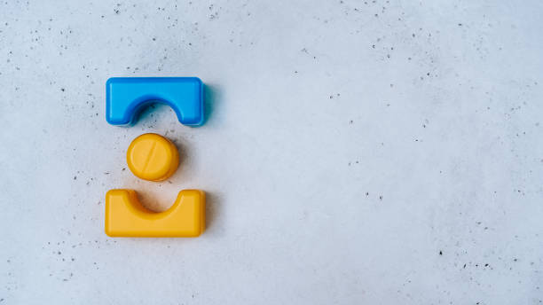 istock Children's blocks on a white concrete background 1144999594