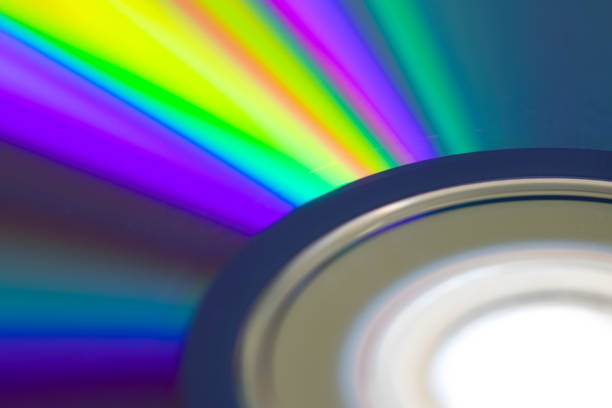 blu ray disc closeup detail with colorful gradient - blu ray disc imagens e fotografias de stock