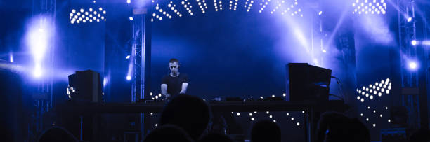 istock Dj playing techno music in the nightclub 1145006901
