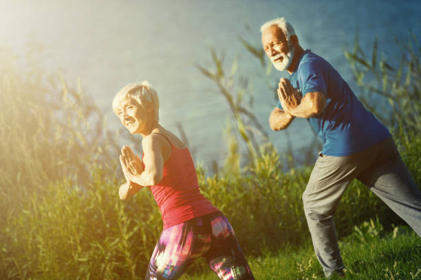 istock Yoga class outdoors. 1145007467