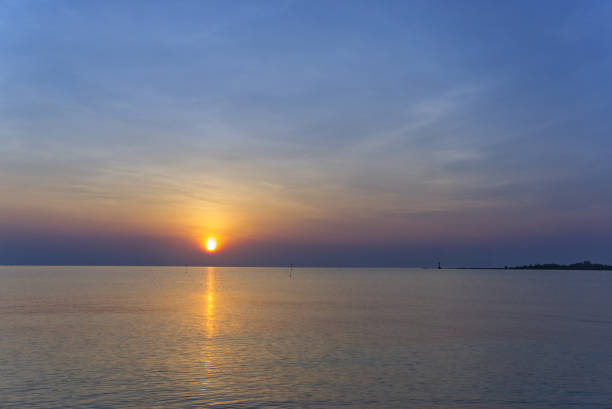 istock sun rise on the ocean 1145007527
