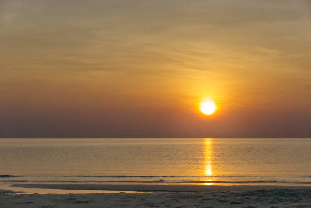 istock sun rise on the ocean 1145007556