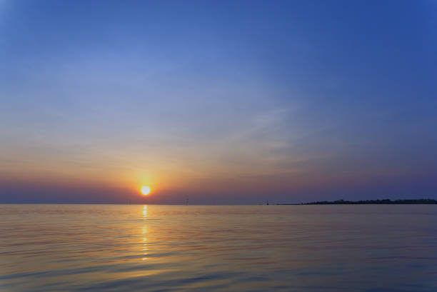 istock sun rise on the ocean 1145007583