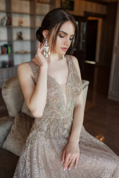 istock Young woman in elegant evening dress, studio shot 1145011695