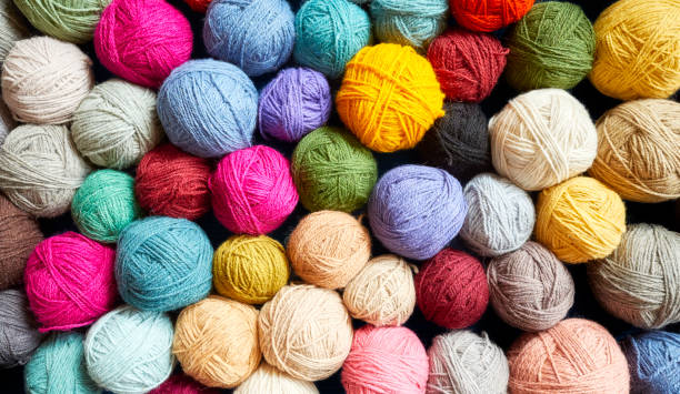 istock Colorful background made of wool yarn balls. 1145013150
