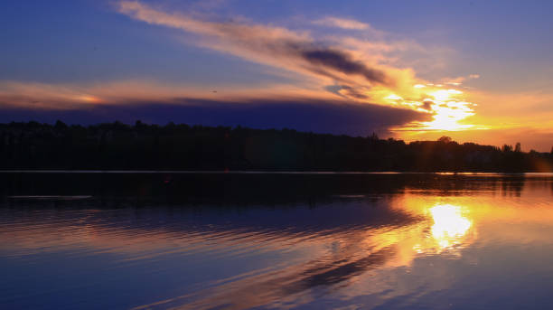 istock Threatening sky at the sunset in the countryside which is reflected 1145014939
