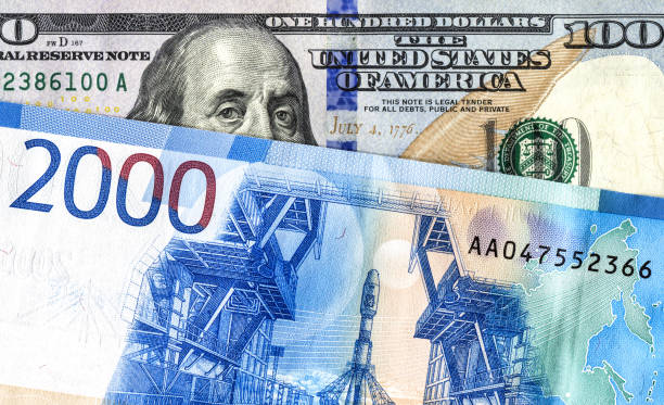istock American 100 dollar banknote and 2000 russian roubles 1145016217