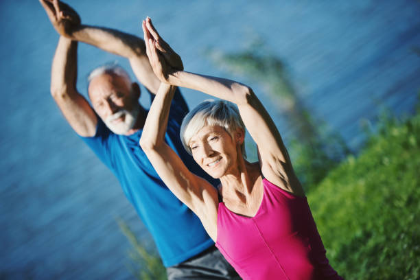 istock Yoga class outdoors. 1145017399