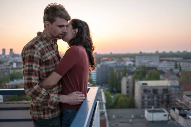istock Love: young couple embracing, sunset, aerial view over Berlin 1145027336