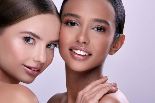 istock two pretty girls smiling 1145028076