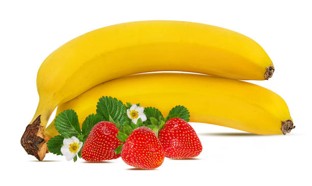 istock Bananas and strawberries isolated on white background with clipping path 1145028147