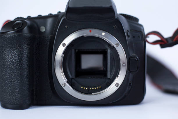istock old SLR camera without lens, camera shutter on a white background close-up 1145029611