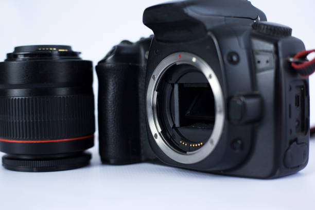 istock old SLR camera without lens, camera shutter on a white background close-up 1145029637