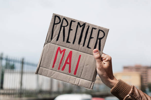 istock text may day in french in a cardboard signboard 1145032258