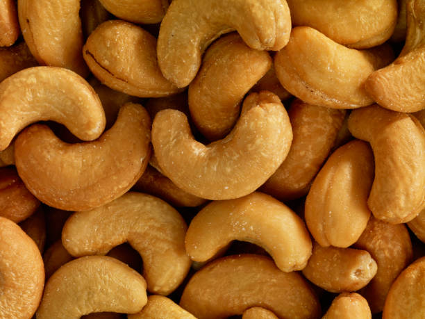 кешью - cashew close up food salted стоковые фото и изображения