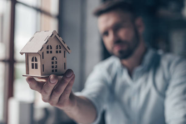 istock Mature man with a house 1145032805