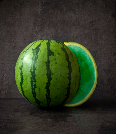 Watermelon with an absurd green slice