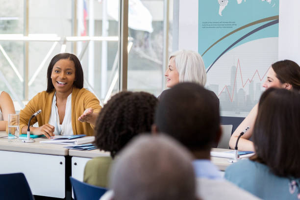 istock Confident businesswoman answers question during panel discussion 1145034110