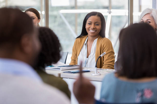 istock Attentive panelist answers question during meeting 1145034123