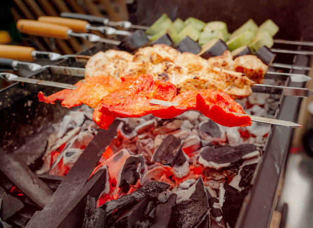 istock Cooking delicious meat with vegetables on barbecue 1145037656