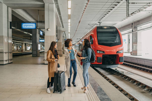 istock Three friends with suitcases travel together 1145038065