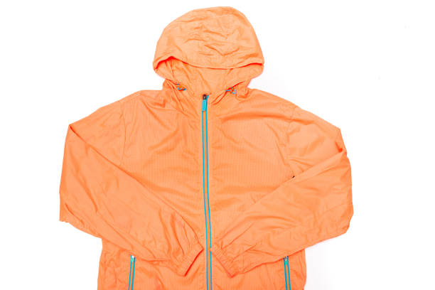 istock yellow-orange windbreaker jacket 1145038813