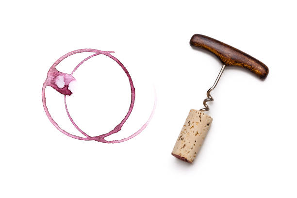 Red wine glass stains, corckscrew and wine cork