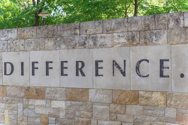 istock Old stone texture of Difference with a dot word on wall brick 1145039354
