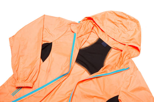 istock yellow-orange windbreaker jacket 1145039416