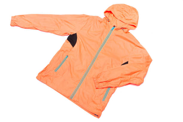 istock yellow-orange windbreaker jacket 1145039674