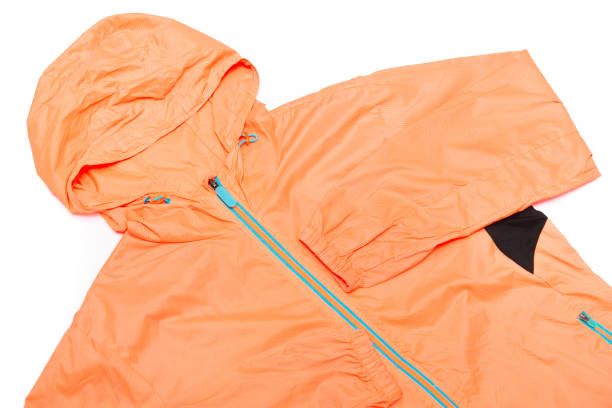 istock yellow-orange windbreaker jacket 1145040542