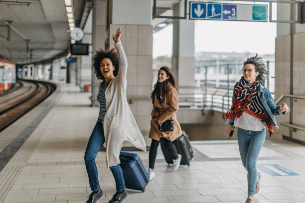 istock Young woman trying to catch the train 1145040921