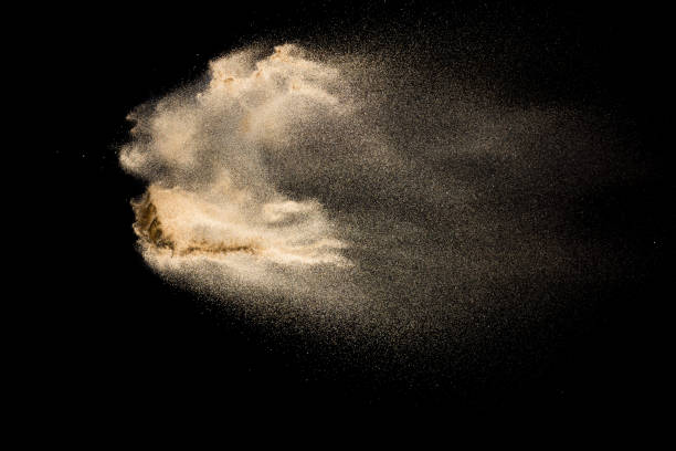 istock Sand explosion isolated on black background. Freeze motion of sandy dust splash. 1145044706