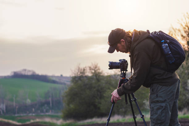 istock Landscape photographer setting tripod before taking picture. 1145045150
