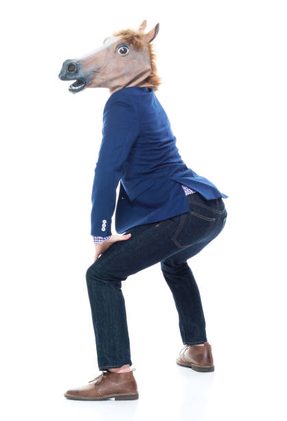 istock Businessman with horse mask is dancing 1145046843