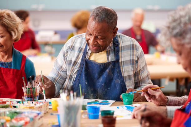 istock Retired Senior Man Attending Art Class In Community Centre 1145048229