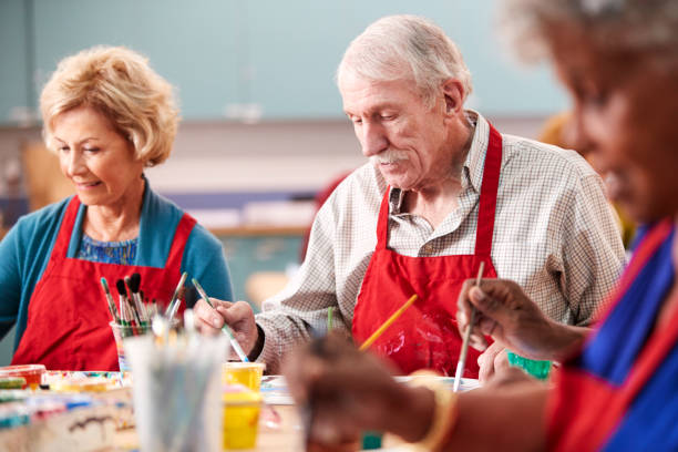 istock Retired Senior Man Attending Art Class In Community Centre 1145048378