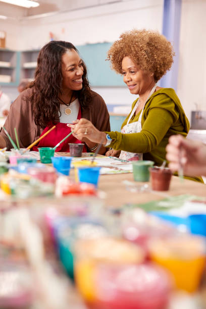 istock Two Mature Women Attending Art Class In Community Centre Together 1145048507