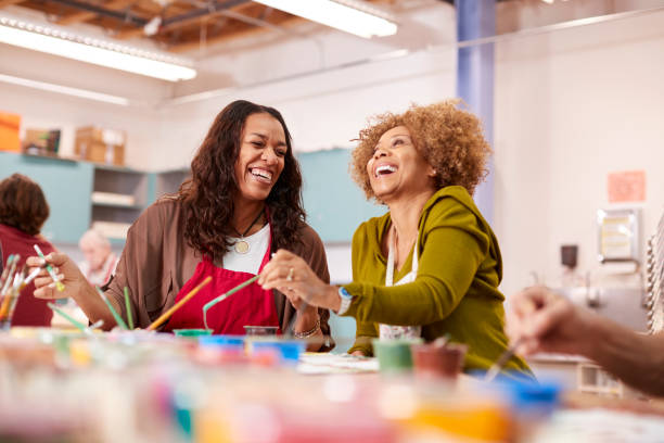 istock Two Mature Women Attending Art Class In Community Centre Together 1145049352