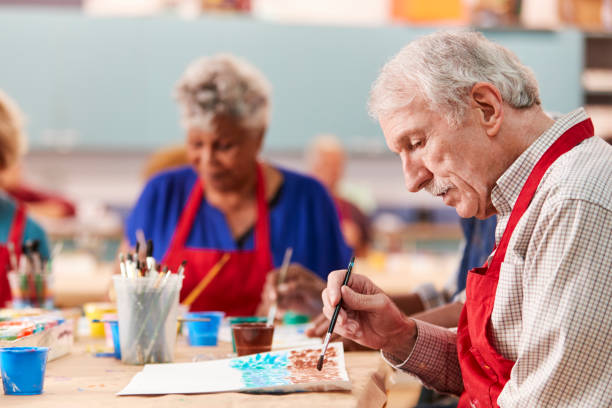 istock Retired Senior Man Attending Art Class In Community Centre 1145049408