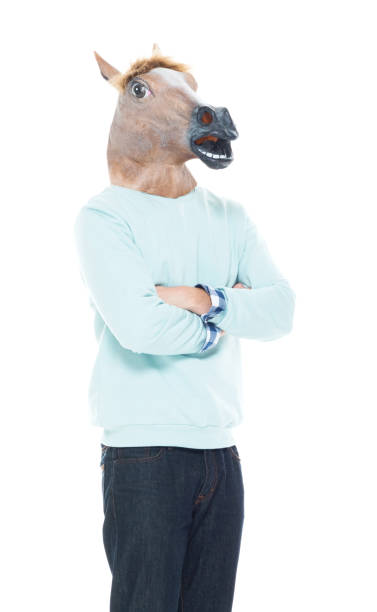istock Man with horse mask standing with arms folded 1145049913