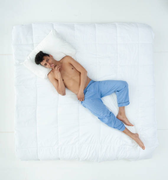 istock Sexy African American man on bed 1145050015