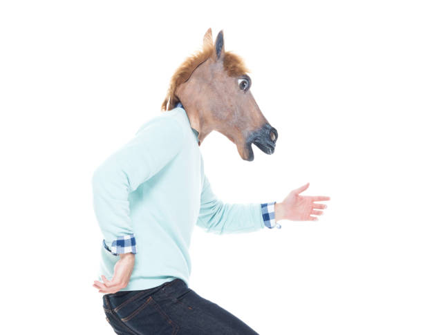 istock Man with horse mask is dancing 1145050330