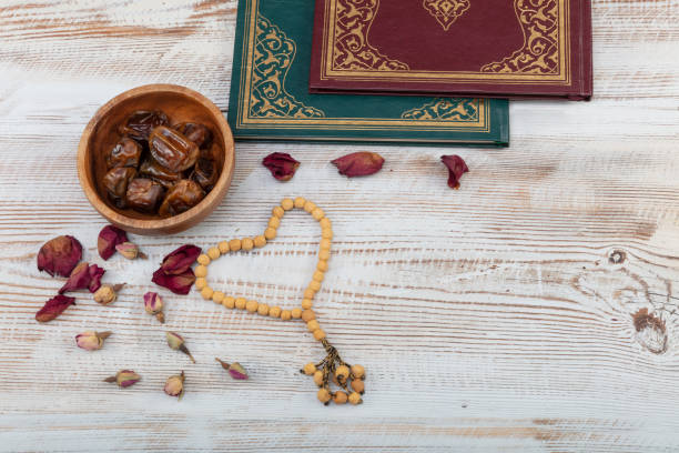 istock Ramadan Kareem concept with premium dates and Quran book. 1145051155