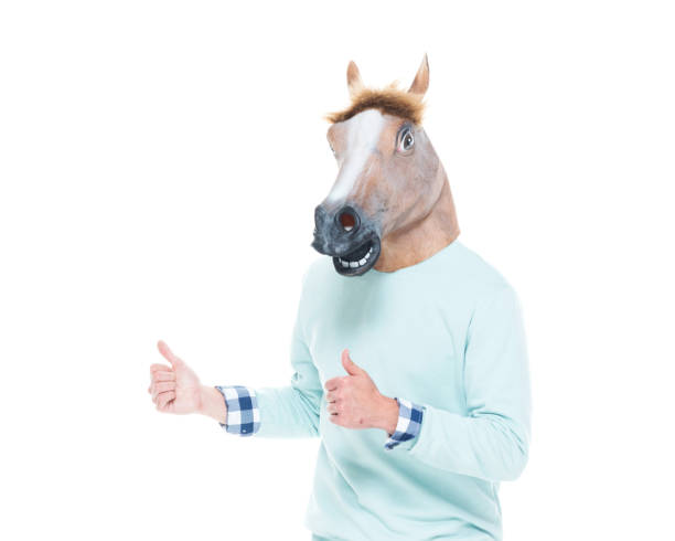 istock Man with horse mask and dancing 1145051468