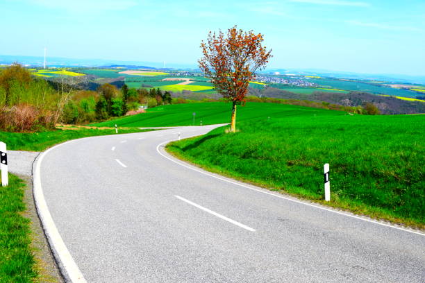 istock country road through green hills 1145051603