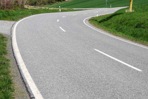 istock country road through green hills 1145051928