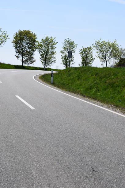 istock country road through green hills 1145053354