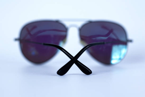 istock Blue mirrored sunglasses with anti-reflective coating and UV protection on a white background. 1145054044