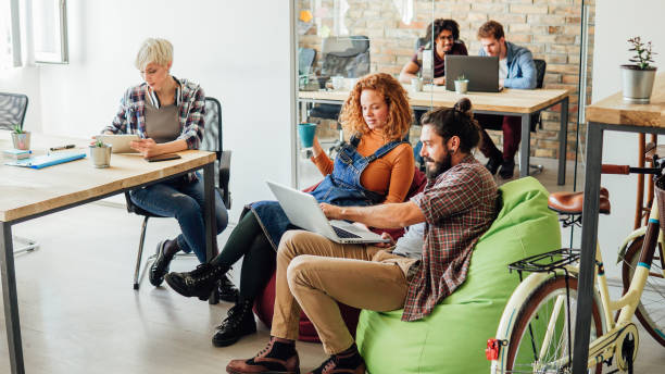 istock Coworkers at co-working space 1145054106